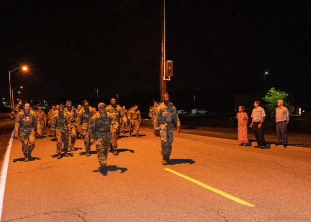 Forty seven years after they lost their father, Alicia Stockdale, Ken Foster Jr. and Rod Foster stand outside the 763rd Ordnance Disposal Company (EOD) headquarters building to support more than 100 service members participating in the Sgt. Maj....