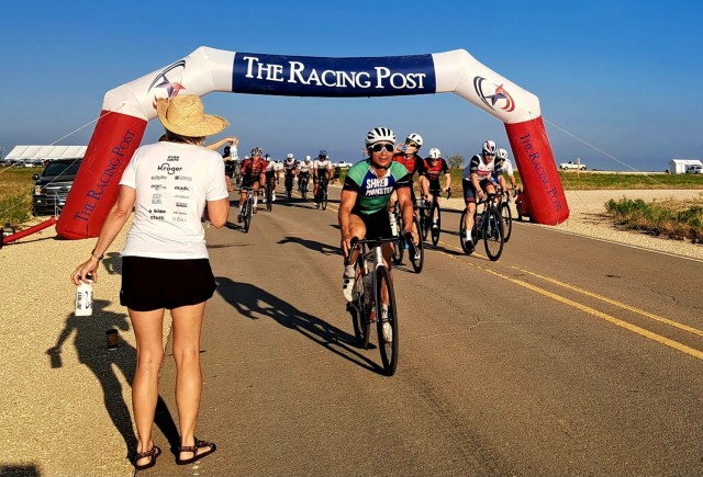 Riders remember to hydrate as they traverse the 33-mile course during the Texas State Road Racing Championships Sept. 23 at Fort Cavazos. (U.S. Army photo by Janecze Wight, Fort Cavazos Public Affairs)