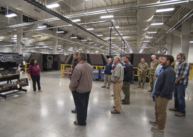 Annette Garrett, an instructor and writer with the 58th Transportation Battalion’s Motor Transport Operator Course, briefs area clergy members Wednesday in the simulator building at Training Area 236 on some of the driver simulation equipment...