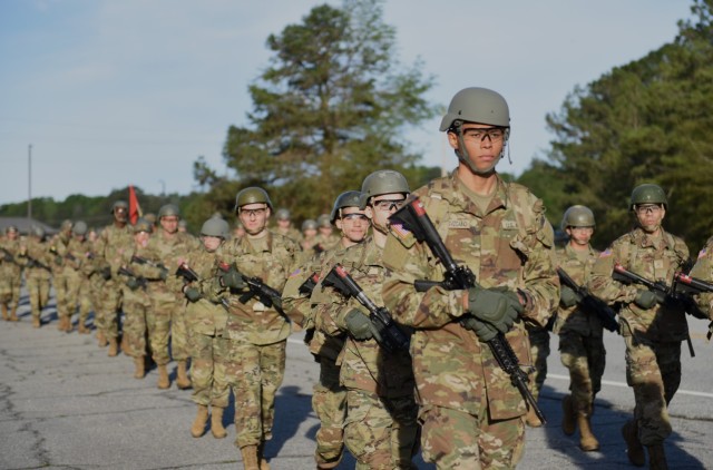 Army infantry recruits with the 2nd Battalion, 58th Infantry Regiment march to the confidence course on Fort Benning, Georgia, March 29. The coures is a series of obstancles meant to build teamwork and confidence as the recruits continue through basic training. 