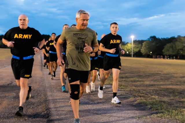 CW4(R) Michael Durant leads PT with USAACE and Fort Novosel Soldiers during PT with the Fallen, an event to commemorate the 30th anniversary of the Battle of Mogadishu on October 6, 2023.