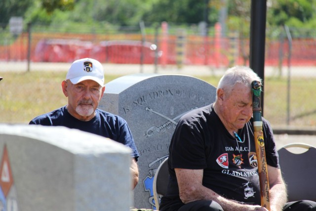 Vietnam Veterans Steve Hayduk, former crew chief, and Ted Kearns, former company commander, remember their fallen comrades during the reading of the names of the fallen at the 57th Assault Helicopter Company monument dedication at Fort Novosel on...
