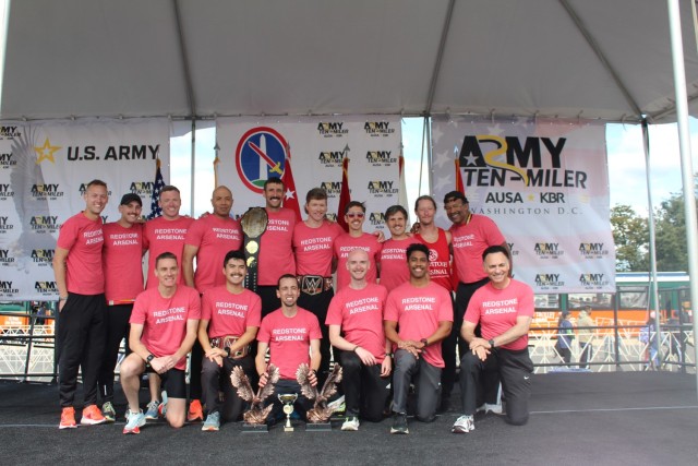 Members of Redstone’s double repeat champion team at Sunday’s 39th annual Army Ten-Miler near the Pentagon include, from left, kneeling, Shaun Tompkins, Javier Nishikawa, Brandon York, Josh Cornett, Blaise Binns and coach Harry Hobbs. Standing...