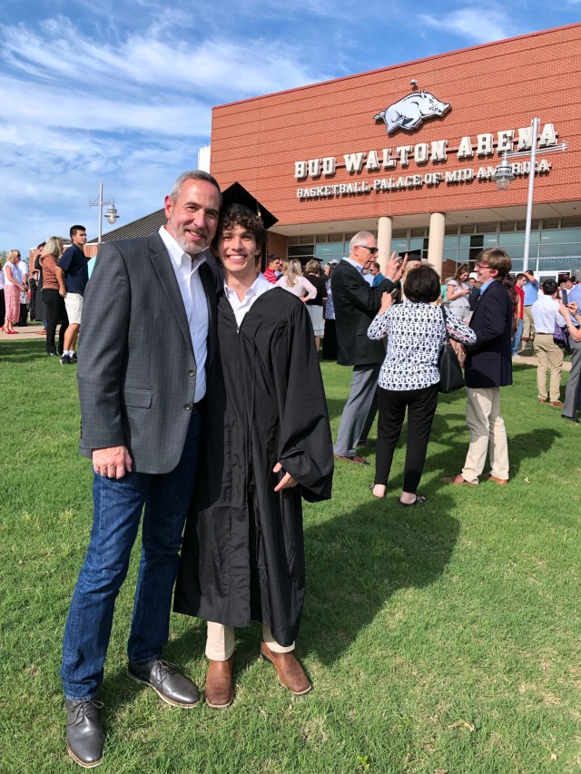 Chris Beckwith [left], and son Conner, celebrate graduation at the University of Arkansas at Fayetteville, May 13, 2022. 