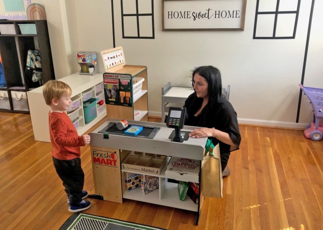 Madison Bosanko, a Family Child Care provider here, interacts with a child under her care Wednesday in her home. Part of the Child and Youth Services child care system available on most Army garrisons, the FCC program is intended to provide...