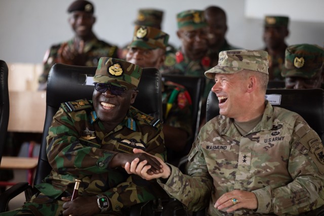 Army Maj. Gen. Todd Wasmund, commander of U.S. Army Southern European Task Force, Africa, and Ghana’s military leadership share a lighthearted moment following the culminating exercise at African Lion 2023 near Daboya, Ghana, June 13, 2023.
