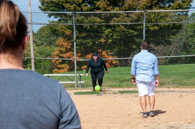U.S. Army Security Assistance Command G8 and G9 team members at New Cumberland, Pennsylvania, took advantage of the fall weather and their lunch break to enjoy a team-building game of kickball.