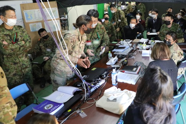 Army judge advocate general officers attend a briefing with Japanese government officials and members of the Japan Ground Self-Defense Force during Yama Sakura 83 exercise at Camp Kengun, Japan, Dec. 9, 2022.