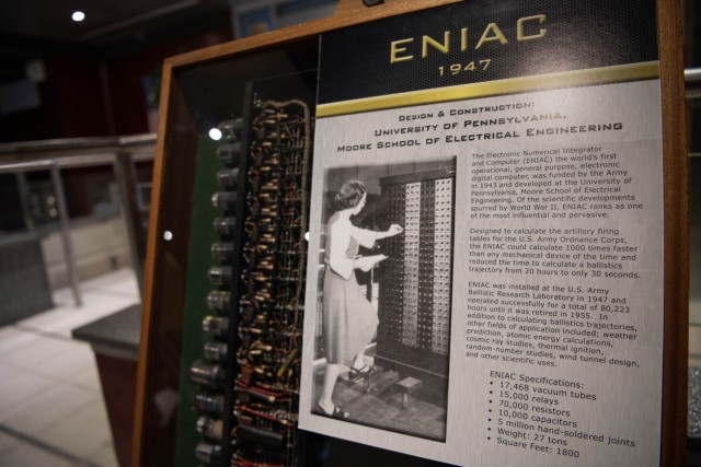 The display shows vacuum tubes from the original ENIAC computer. 