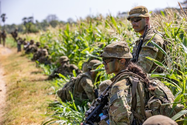 A group of Australian Defense Force (ADF) Soldiers, takes a knee while moving to the objective with their assigned weapon during a rehearsal for a Combat Live Fire Exercise during Exercise Super Garuda Shield 2023, at the 5th Marine Combat Training Center, Puslatpur, East Java, Indonesia., Sept. 9, 2023. Super Garuda Shield 2023 (SGS2023) is an annual exercise that has significantly grown in scope and size since 2009. SGS2023 is the second consecutive time this exercise has grown into a combined and joint event, highlighting the 7 participating and 12 observing nations&#39; commitment to partnership and a free and open Indo-pacific. 