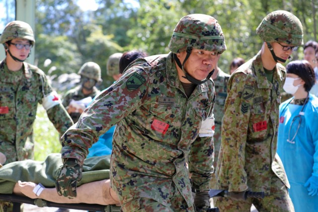 Members of the Japan Ground Self-Defense force conduct assessments on simulated casualties during the Orient Shield 23 training exercise at Kamifurano Training Area, Hokkaido, Japan, September 16, 2023. As a part of a bilateral training exercise, the U.S. Army and the Japan Ground Self-Defense Force aim to acquire novel techniques and establish collaborative ties between allied countries. 

