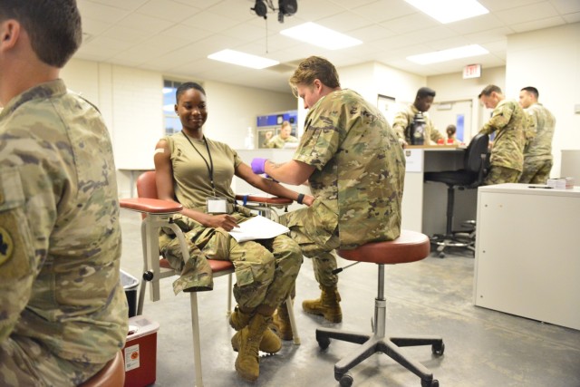 A medic attends to a Georgia Army National Guard Soldier during readiness processing at Fort Stewart, Ga., Oct. 20, 2023.
