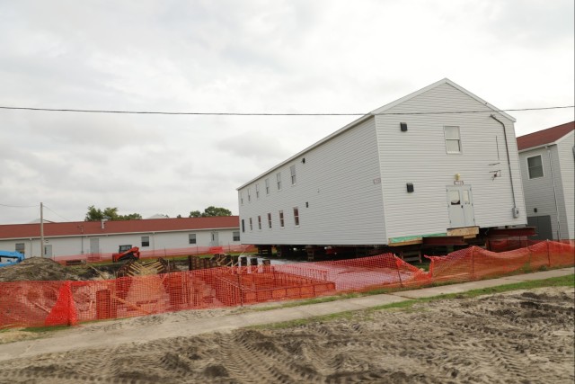 Work to build new foundations for relocated World War II-era barracks continues at Fort McCoy
