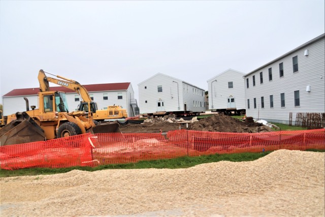 Work to build new foundations for relocated World War II-era barracks continues at Fort McCoy