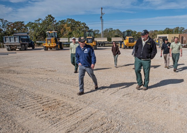 Kenneth Carter, a pavements and equipment training instructor with Fort Leonard Wood’s Air Force 368th Training Squadron (left), talks with Darren Morris, a transportation engineer with the Mark Twain National Forest Service, as they walk from...