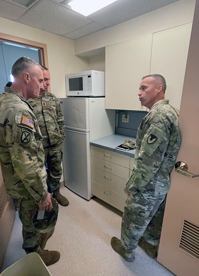FORT DETRICK, Md. -- Left to right: Brigadier General Edward H. “Ned” Bailey, Commanding General, U.S. Army Medical Research and Development Command and Fort Detrick, and Command Sgt. Maj. Kyle S. Brunell, U.S. Army Medical Research and Development Command and Fort Detrick, tour barracks undergoing renovations here with U.S. Army Garrison Fort Detrick Command Sgt. Maj. Michael D. Dills II.