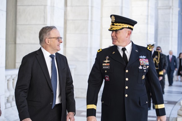 Australian Prime Minister Anthony Albanese, left, and Joint Task Force - National Capital Region and U.S. Army Military District of Washington Commanding General Maj. Gen. Trevor J. Bredenkamp, right, walk through the Memorial Amphitheater at...