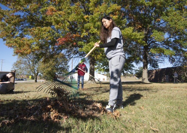 Pfc. July Pineda, a unit supply specialist with Headquarters and Headquarters Company, 5th Engineer Battalion, rakes leaves Saturday behind the Army Community Service building during Fort Leonard Wood’s 2023 Make a Difference Day event. A...