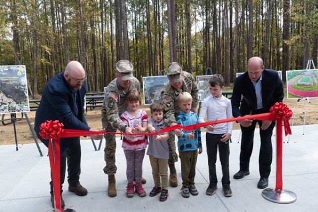 Cutting the ribbon Monday for the Outdoor Learning Center are, from left, 
 Don Henderson, the Garrison’s energy manager; Redstone Senior Commander Lt. Gen. Chris Mohan, deputy commanding general of the Army Materiel Command; Adelaide Callaway, Collier Malone, Garrison Commander Col. Brian Cozine, Jack Gauthier, Maxwell Callaway, and Madison Mayor Paul Finley. 
