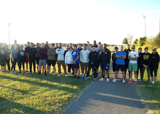 Participants in the Army Community Service-hosted 5k run/walk in support of October’s Domestic Violence Awareness Month pose for a photo Saturday in the Main Exchange parking lot. The event coincided with Make a Difference Day, a national...