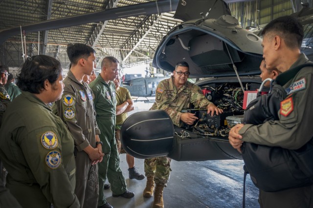 Hawaii Army National Guard 1st Sgt. Clayton Perreira, Charlie Company, 1st Battalion, 183rd Aviation Regiment commander, conducts a standardization subject matter expert exchange with the Philippine Air Force at Brigadier General Benito N. Ebuen Air Base, Lapu-Lapu City, Philippines, Sept. 27, 2023.