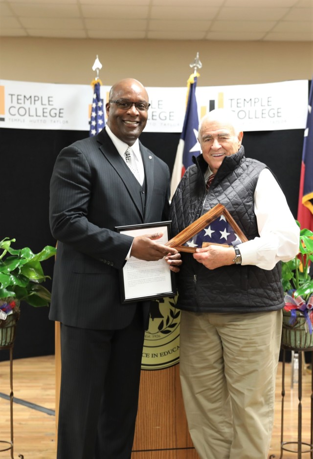 Rep. John R. Carter (TX-31) presents retired Sgt. 1st Class Steven Moore, chief of community relations for U.S. Army Garrison-Fort Cavazos, with the Congressional Veteran Commendation for his life-long commitment to community service Oct. 7, 2023, at Temple College. (U.S. Army photo by Erick Rodriguez, Fort Cavazos Public Affairs)