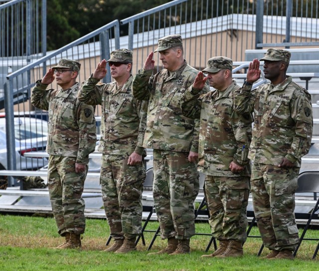 The official party renders a salute during the 369th Sustainment Brigade change-of-command ceremony held on October 22, 2023, at Camp Smith Training Site in Cortlandt Manor, New York. Pictured are, from left Command Sgt. Major Curtiss Moss, the outgoing command sergeant major; Col. Seth Morgulas, the outgoing brigade commander; Brig. Gen. Joseph Biehler, the commander of the 53rd Troop Command; Col. Patrick Clare, the incoming brigade commander, and Command Sgt. Major Leyland Jones, the incoming brigade commander sergeant major. (U.S. Army National Guard photo by Staff Sgt. Matthew Gunther)