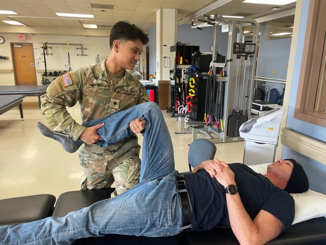 Spc. Joelle Pamplona, physical therapy specialist, provides joint mobilization treatment on a patient at Madigan Army Medical Center on Joint Base Lewis-McChord, Washington. Pamplona helps veterans, Soldiers and their families recover from various injuries. 