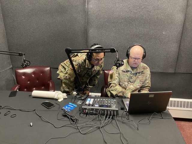 Sgt. 1st Class Osvaldo Equite, left Staff Sgt. Jarred Woods,  prepare to record a podcast featuring Sgt. Maj. Craig Collins, Department of Curriculum Development at the NCO Leadership Center of Excellence, to discuss his article &#34;Project Athena in Action,&#34; at Fort Leavenworth, Kansas, on Nov. 16, 2021.
