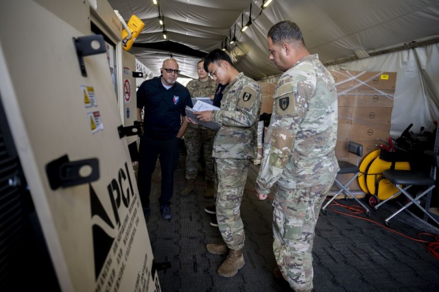 Team members with 44th Medical Brigade and U.S. Army Materiel Command participate in practical application during an Expeditionary Deployable Oxygen Concentration System (EDOCS) training, Fort Detrick, Md., Sept. 28, 2023. The training was a...