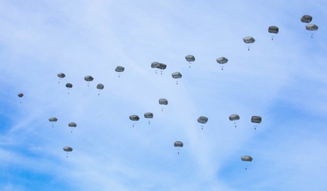 U.S. Army Paratroopers assigned to 3rd Brigade Combat Team, 82nd Airborne Division, perform an airborne demonstration during the Thunder Over the Rock air show on Little Rock Air Force Base, Arkansas, Oct. 21, 2023. About 200 Paratroopers, from Fort Liberty, North Carolina, demonstrated their capabilities as masters of the joint force entry when they secured an airfield during the small-scale seizure exercise. Thunder Over the Rock, a free community event, highlights military aerial capabilities and aims to inspire future generations in opportunities within the aviation industry. (U.S. Army photo by Pfc. Jayreliz Batista Prado)