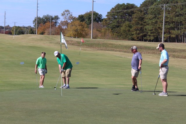 Playing the ninth hole on the Warrior course at the Links on Saturday are, from left, Jory Jackson, Fred O’Connor, Greg Gann and his son Will. 