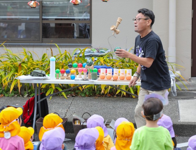 A “kendama” performer displays his skills in the Japanese cup-and-ball game during a Fall Festival at the Camp Zama Child Development Center in Japan, Oct. 31, 2023. The center invited nearly 20 local Japanese preschoolers to help celebrate its annual festival.