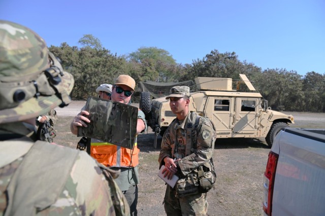 Benjamin Roberts, Cultural Resources Project Director (Contractor), discusses training scenarios, as well as the identification and protection of cultural heritage assets, with Capt. Lam of the 425th Civil Affairs BN during the JPMRC rotation.