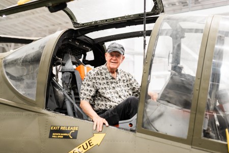 AH-56 Cheyenne test pilot, David Schnitker, sits inside the aircraft that he flew in 1969. 