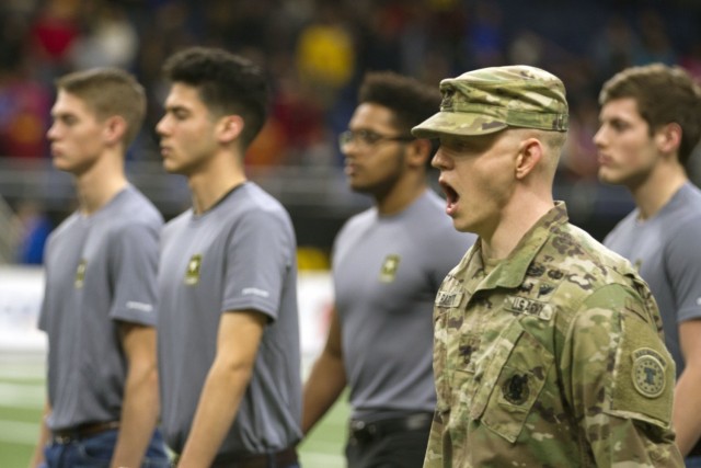 A U.S. Army Soldier marches recruits onto the football field at the Alamodome where they will take their oath of enlistment before the U.S. Army All-American Bowl Jan. 6, 2018, in San Antonio, Texas. The All-American Bowl is the nation’s premier high school football game, serving as the preeminent launching pad for America’s future college and National Football League stars. 