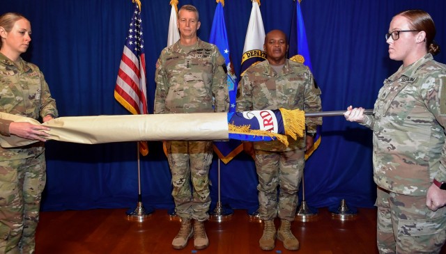 Army Gen. Daniel Hokanson, chief of the National Guard Bureau, presents the positional colors to Senior Enlisted Advisor Tony Whitehead at Joint Base Myer-Henderson Hall, Va., Nov. 1, 2023. This marks the first time a senior enlisted advisor to the National Guard chief is recognized with such colors, a milestone in a tradition that dates to 1636.  (U.S. Army National Guard photo by Sgt. 1st Class Elizabeth Pena)