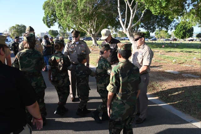 On September 30, 2023, U.S. Army Yuma Proving Ground Commander Col. John Nelson and Command Sgt. Maj. Mark Millare greet Young Marines at a ceremony honoring the Bushmasters, Soldiers of the 158th Regimental Combat Team who earned international...
