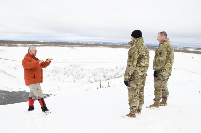 Cold Regions Test Center (CRTC) Technical Director Jeff Lipscomb gives Yuma Proving Ground Commander Col. John Nelson and Command Sgt. Maj. Mark Millare a tour of the Mobility Test Complex.