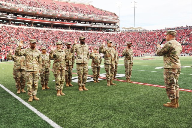 1st TSC Soldiers reenlist during Cardinal football’s ‘Salute to Service’ game