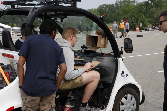 A team participating in the Self-Drive Challenge makes adjustments to their vehicle on the final day of the 30th Annual Intelligent Ground Vehicle Competition June 5, 2023, at Oakland University in Auburn Hills, Michigan. The U.S. Army Combat Capabilities Development Command, DEVCOM, Ground Vehicle Systems Center has been a major contributor to the IGVC since 1993. DEVCOM GVSC fosters the advancement of science, technology, engineering and math education through its continued work with college students. 
