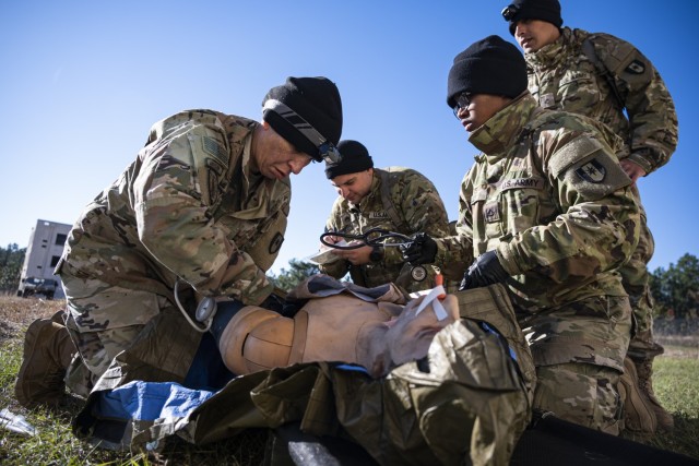 U.S. Army Soldiers with the 36th Medical Company Area Support (MCAS) treat a combat casualty mannequin during a field exercise and operational assessment, Fort Liberty, North Carolina, Nov. 2, 2023. D