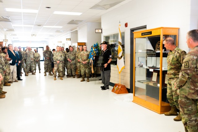 Chief Warrant Officer Five (Retired) Charlie Poulton displays Yarborough knife to service members inside Swartworth Hall on Fort Novosel on Nov. 6, 2023.