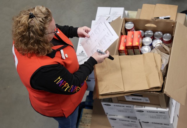 Red Cross packs over 120 sacks with food for Soldiers and their Families to enjoy during Thanksgiving