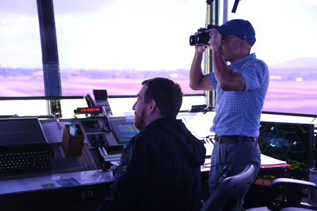 The traffic control team at Wheeler Army Airfield monitors the intricate aircraft arrivals and departures.