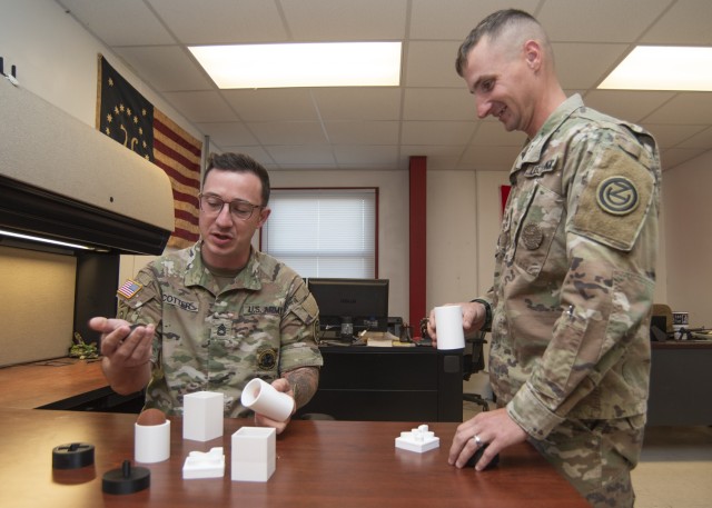 Sgts. 1st Class Anthony Cotter (left) and Lee Sweeney discuss the various 3D-printed explosives containers that were tested here in a partnership between the Army Reserve’s 102nd Training Division (Maneuver Support) and the installation’s Counter Explosive Hazards Center during a two-week Combat Engineer Reclassification Course in October. 