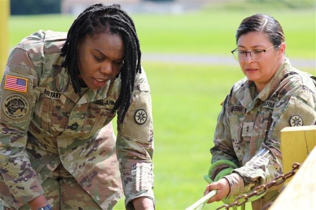 Master Sgt. Karen Bryant, left, is a member of the Army Reserve and a Department of the Army Civilian. Her background includes teaching small group courses on leadership.