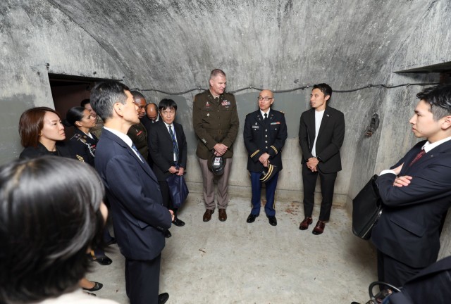 Several Shinto priests and members from the Association of Shinto Shrines visit the emperor&#39;s bunker during a tour of Camp Zama, Japan, Nov. 9, 2023. The U.S. Army Japan Chaplain’s Office invited them to the installation as part of an ongoing effort to increase interfaith dialogue with its unit ministry teams.