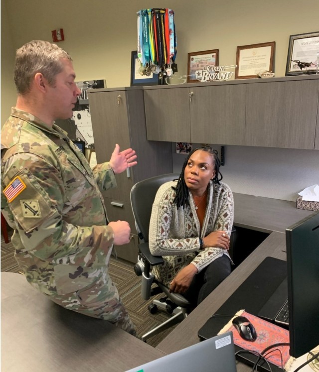 Next Generation Combat Vehicles Cross-Functional Team (NGCV CFT) employees Maj. Brian Szczepanek, left, and Karen Bryant are members of the Army National Guard and Army Reserve, respectively.
