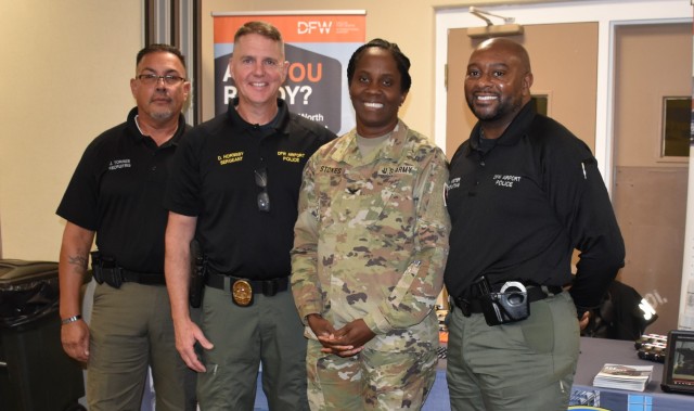 Col. Lakicia Stokes, U.S. Army Garrison-Fort Cavazos commander, poses with Det. Juan Torres, Sgt. David Hornsby and Det. Robert Mister, Dallas Fort Worth Airport Police, at the annual Red, White and You Career Fair Nov. 1 at the Lone Star Conference Center. (U.S. Army photo by Janecze Wright, Fort Cavazos Public Affairs)